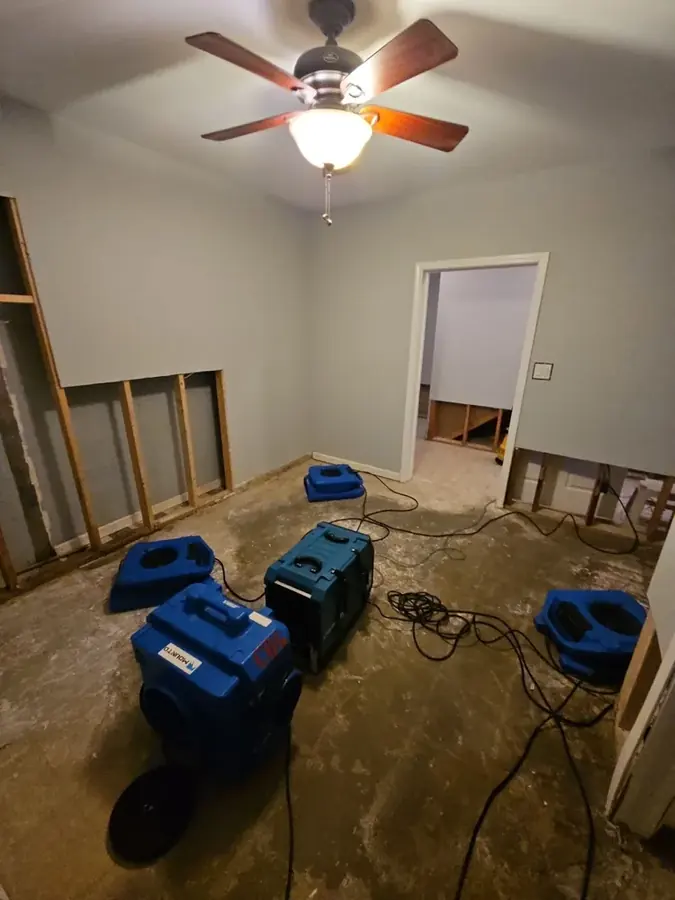 Air movers and a dehumidifier running in a dried room
